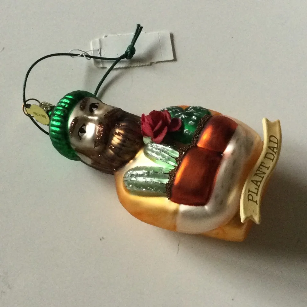 CODY FOSTER PLANT DAD GLASS CHRISTMAS ORNAMENT NEW IN BOX 5” x 2.5”